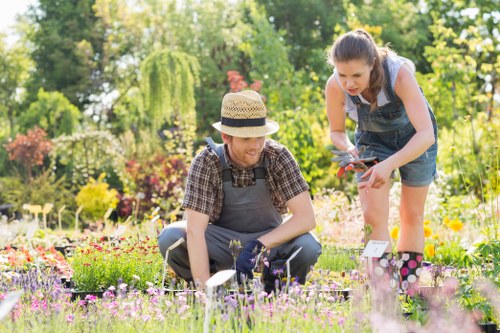 Team of gardeners with tools in a Chelsea garden